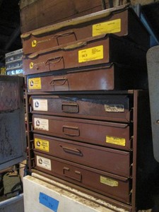 Metal compartmentalized hardware organizers with content