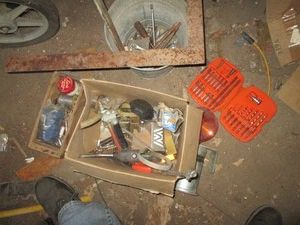 Drill bits, variety of sockets, soldering wire, tire filler air chucks, wrenches plus other hand tools and hardware