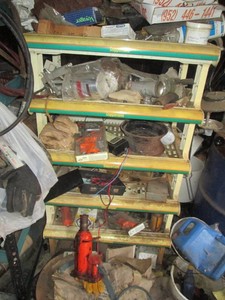Coppertone plastic retail display with content shown including new pipe clamps, bottle jack, automotive supplies and more