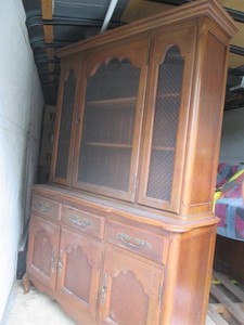Vintage wood 1pc China hutch with glass front doors, drawer and additional storage behind lower doors