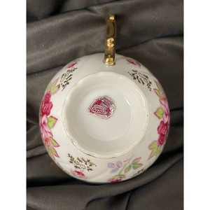White Porcelain Floral Teacup and Saucer Set with Gold Trim