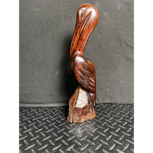 Hand-Carved Dark Wood Pelican Sculpture on Natural Base