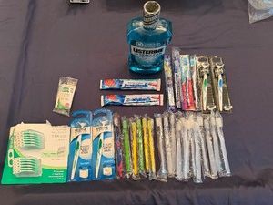 New Bottle of Mouthwash, New in Package Toothbrushes and Flossers