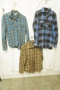 counter intelligence size medium blue black yellow plaid, canyon guide size medium blue and black plaid long sleeve flannel, timberland size large olive green brown and red plaid flannel