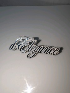 Vintage Cadillac dElegance roofpillar emblem badge, serial number on back
