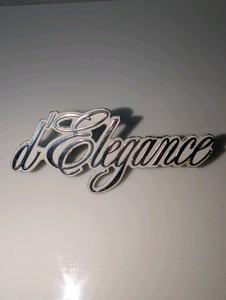 Vintage Cadillac dElegance script emblem, serial number on back