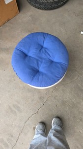 white whicker stool with blue cushion