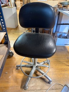 Adjustable Black Upholstered Drafting Stool With Casters