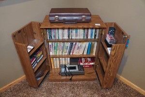 Media Storage Cabinet with Books and Cassettes