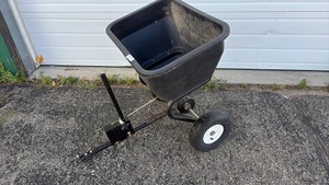 Pull behind fertilizer spreader