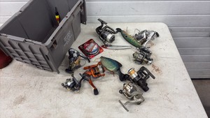 Eight fishing reels with lures and line