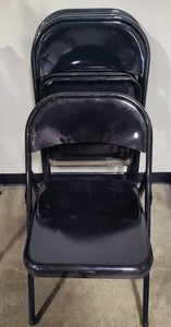 Four Black Metal Folding Chairs