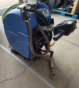 Used Caliber walk-behind floor scrubber. item turns on unsure  about how it functions. purchasing as- is.