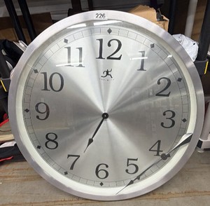 Large oversized in infinity wall clock dial fell off, needs to be fixed 32 inches in diameter