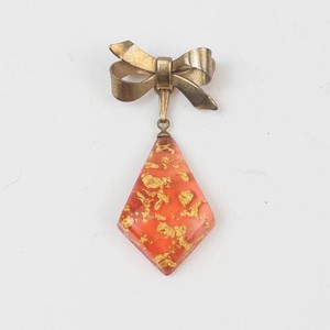 Bow Brooch With Red Gold-Fleck Pendant