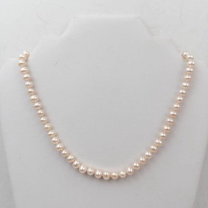 Graduated Cream Pearl Necklace With Decorative Clasp