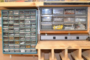 Two Wall-Mounted Fastener Organizers with Contents