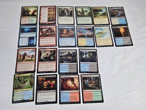 Lot of 20 Magic The Gathering Rare Cards including cards like Clan Defiance, The Akroan War, Commit, Tooth and Claw