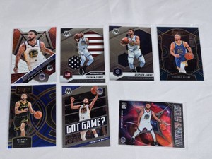 Lot of 7 Stephen Curry Basketball Cards including Mosaic National Pride and Select editions.