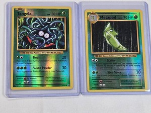 Lot of 2 Pokemon Holo Cards Featuring Tangela and Metapod