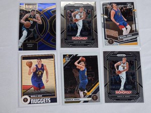Lot of 6 Nikola Jokic Basketball Cards including Panini Select, Monopoly Prizm, Hoops, Optic with Denver Nuggets features.