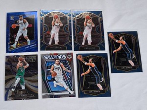 Lot of 7 Luka Doncic Basketball Cards including Panini, Select, and Mosaic sets featuring special features like Turbo Charged and Will to Win.