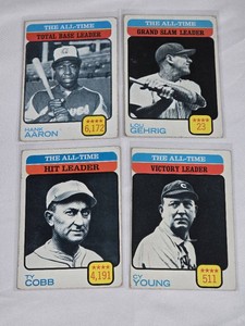 Lot of 4 Vintage Baseball Cards Featuring Hank Aaron, Lou Gehrig, Ty Cobb, and Cy Young. Includes Leaders for Total Bases, Grand Slams, Hits, and Victories.