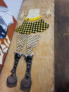 Art Piece with Custom Punk Moto Jacket Safety Pin Artwear Black Cropped Jacket and Vintage Ceramic articulated harlequin or jester puppet parts