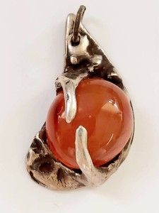 Vintage Silver-Tone Claw Pendant with Orange Stone