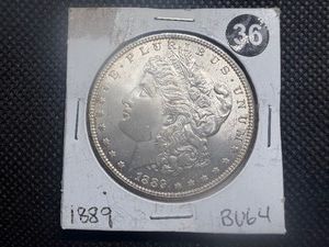 1889 Morgan Silver Dollar Marked BU64 When Purchased