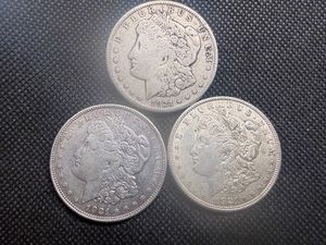 Three  Morgan Silver Dollars 1921-P-D-S.
