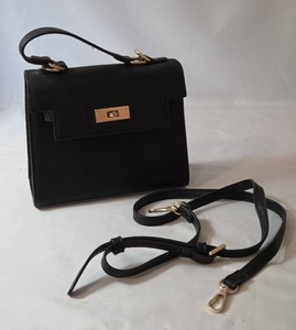 Classic Womens Black small satchel handbagcrossbody with gold hardware.  Includes cross-over strap. Faux leather. Bag is 8 W x 6.5 T x 3Depth.   Bag is in new condition.
