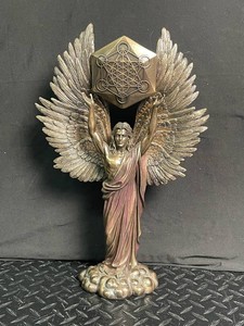 Winged Angel Figurine With Geometric Emblem