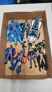 Miscellaneous slot of Batman DC action figures and motorcycle.