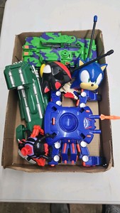 Miscellaneous lot sonic walky talkies,transformers,spider man vehicles.