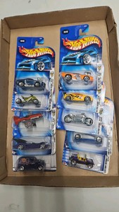 Lot of ten mattel hot wheels in package pontiac g t o,mustang,batmobile etc