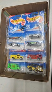 Lot of a 8 Hot Wheels 164 toy cars. 24 car series sets sports car series fire squad series.