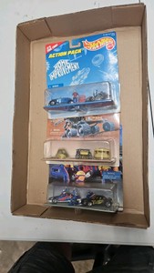 Lot of 3 material Hot Wheels 164th scale diecast car action packs.