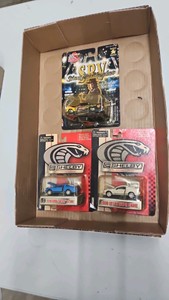Lot of 3 164th scale dye cast cars. ford Shelby Cobra Stevie ray von racing champions.