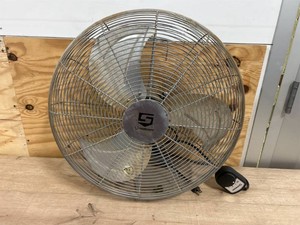 Oscillating wall mounted fan