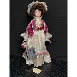 Heritage Mint Porcelain Doll in Pink and Ivory Dress