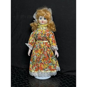 Artmark Blonde Porcelain Doll in Floral Dress with Stand
