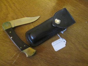 Buck pocket knife with leather case...