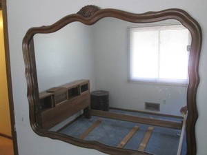 Vintage scalloped wood framed mirro...
