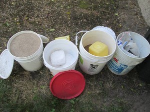 Misc buckets of Oil-dry, sand and i...