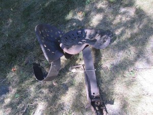 Pair of cast iron tractor seats on ...