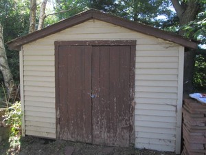 10.5 x 12 Foot shed with metal siding and shingled roof