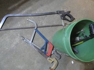 5-gallon pail with various hack saw...