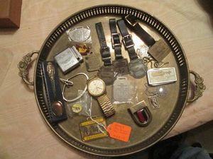 Silver platter filled with assorted notions