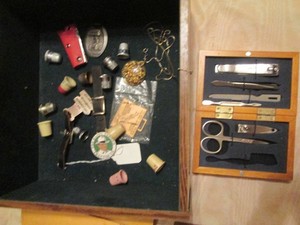 Tray of thimbles, notions and nail care kit